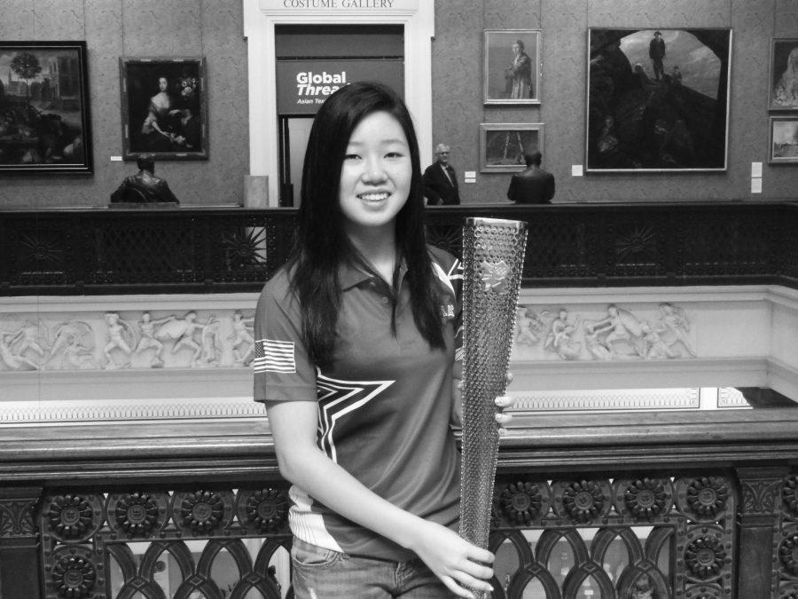 Lily+Zhang+holds+the+Olympic+Torch+in+Manchester.