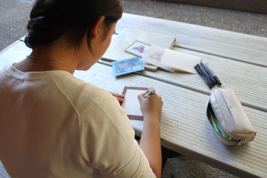 Junior Annie Chen works on her art projects to help raise money for the Paly Art Department.