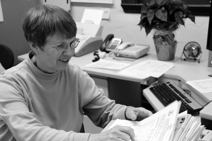 Suzie Brown keeps meticulous records of transcripts and assists seniors in the college application process. 