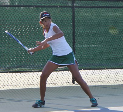 Senior Aashli Budhiraja, the number one singles player, hits a forehand during a singles math against Saratoga High School.