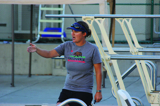 Girls’ varsity water polo coach Ilene Delaney instructs her team through a practice earlier this year. Delaney, like other coaches, must be able to effectively coach players through verbal instructions.