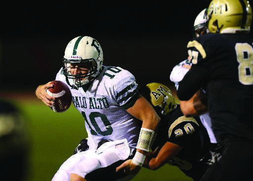 Senior Keller Chryst scrambles to avoid a tackle against an Archbishop Mitty defender in a 34-14 loss on Sept. 21.