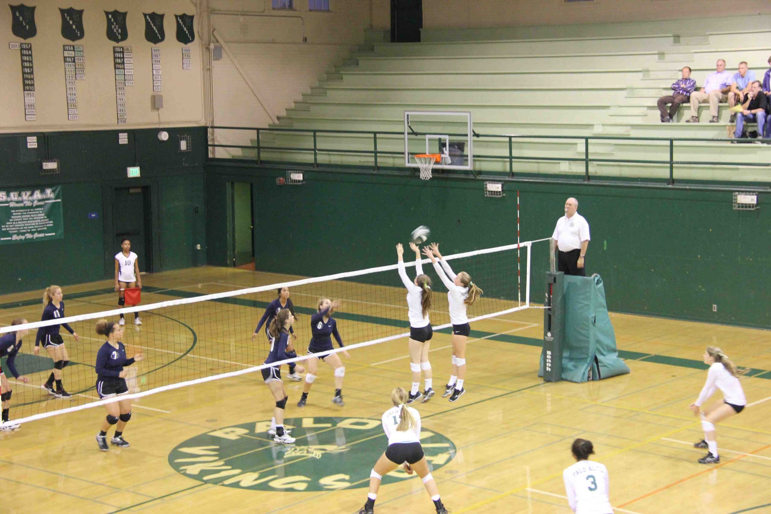Juniors Abby Strong and Molly Fogarty  block a spike during a recent match against Kings Academy. The Vikings are  12-4.