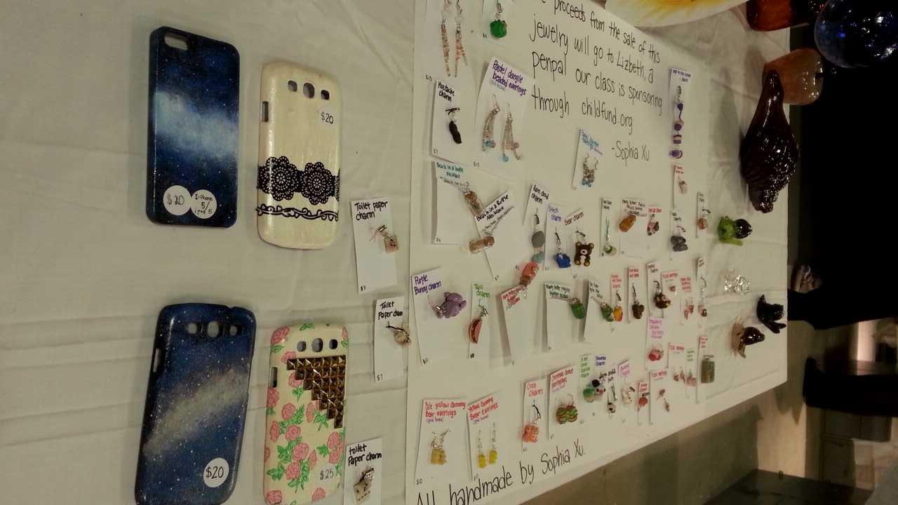 Sophomore Sophia Xu displays her homemade phone cases and earrings at the Paly Winter Glass Sale earlier this year.