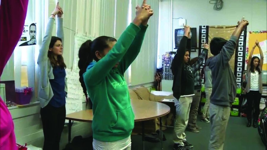 Students at Cesar Chavez Academy  in East Palo Alto do yoga as a part of a research  project directed by Stanford researchers.