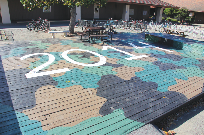 The Senior Deck flaunts its camouflage design a day after a group of juniors painted a “5” over the “4” in “2014,” but was taken off by seniors.