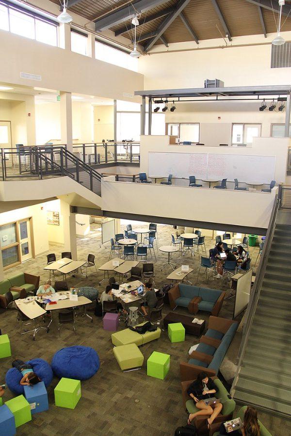 As seen from the second floor of the recently opened Media Arts Center, students utilize the atrium after school for socializing and studying. This building was opened this school year in partnership with the new math and social studies building.