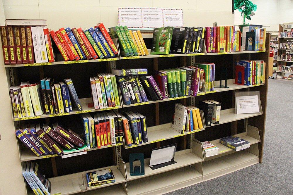 Insufficient textbook supply prevents students from completing bookwork at school. 