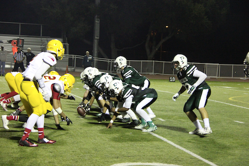 Paly prepares to hike the ball against Wilcox in their first league game of the season.