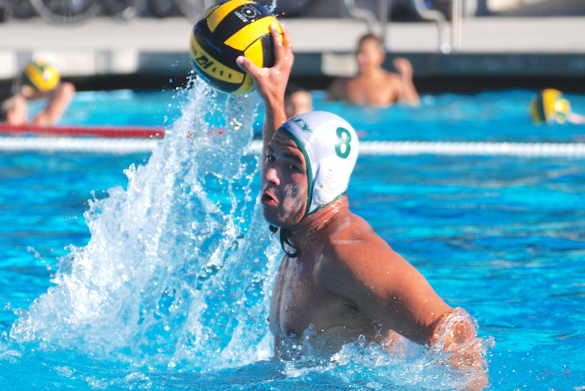 Varsity boys water polo player Kevin Bowers attempting to score a goal in a game against Henry M. Gunn High School