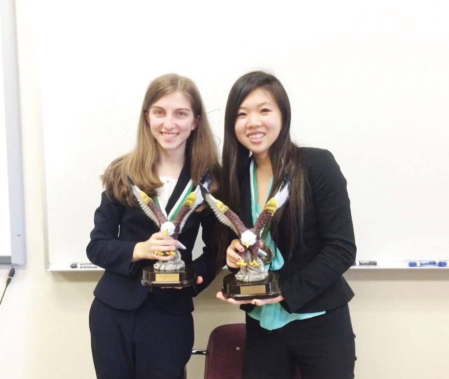 Junior+Anna+Lu+poses+with+her+final+opponent+after+winning+the+varisty+Lincoln-Douglas+debate+division+at+the+Harker+Invitational+Tournament+.