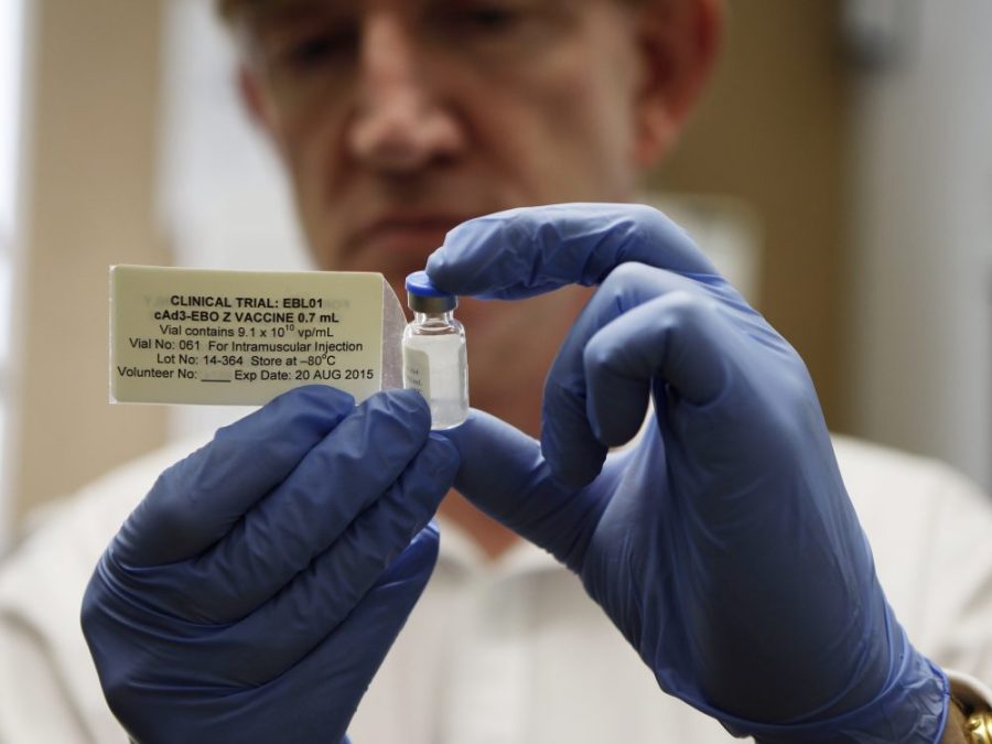Director of the Jenner Institute and chief investigator of the trials, Adrian Hill, holds a vial of the Ebola vaccine his organizaiton developed.