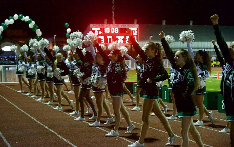 Cheerleaders preform at a Palo Alto High School event alongside the dance team.