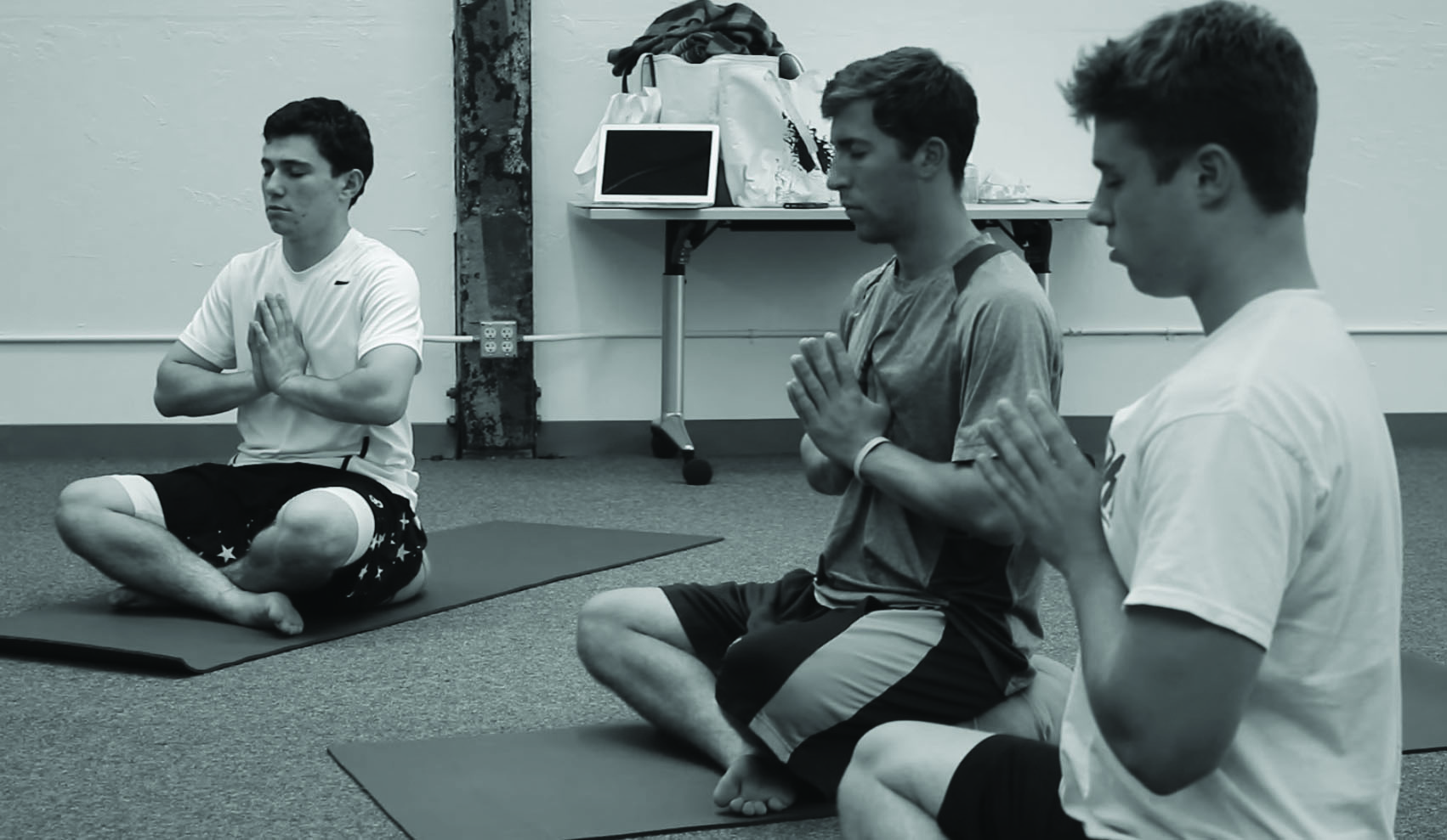 Palo Alto students meditate during a student-geared yoga class lead by Clia Tierney.