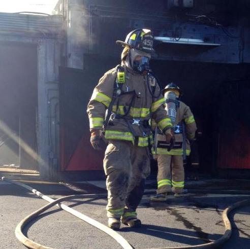 Walker Mees participates in an emergency simulation as a part of his fire training.