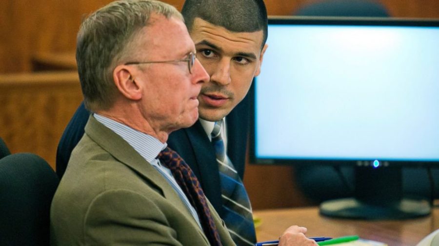 Ex-Patriot Tight End Aaron Hernandez talks to his attorney as he was tried murder. He was convicted and is serving life in prison.