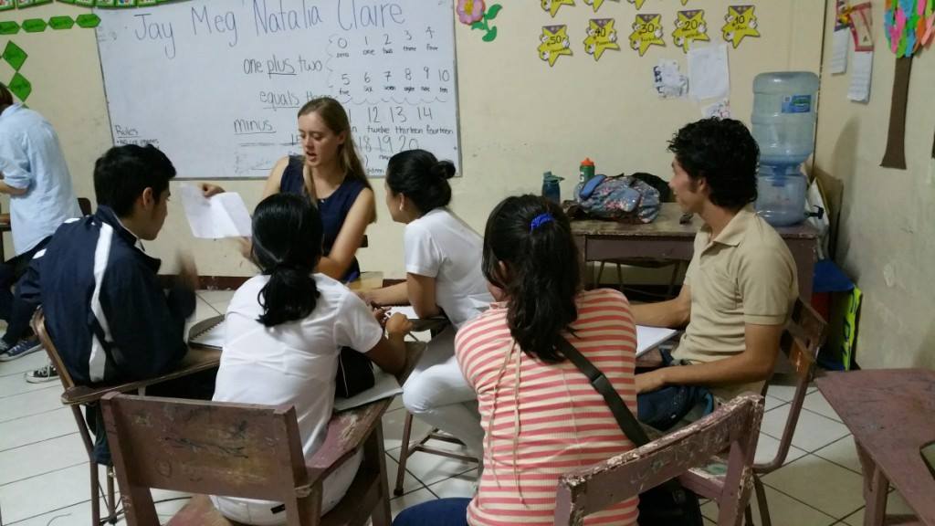 While on her Global Glimpse service trip, senior Claire Krugler teaches students in her English class in Matagalpa, Nicaragua.