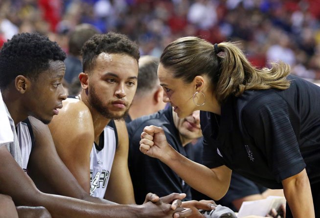Becky Hammon, head coach of the San Antonio Spurs NBA Summer League team, talks to players in a game versus the NY Knicks.