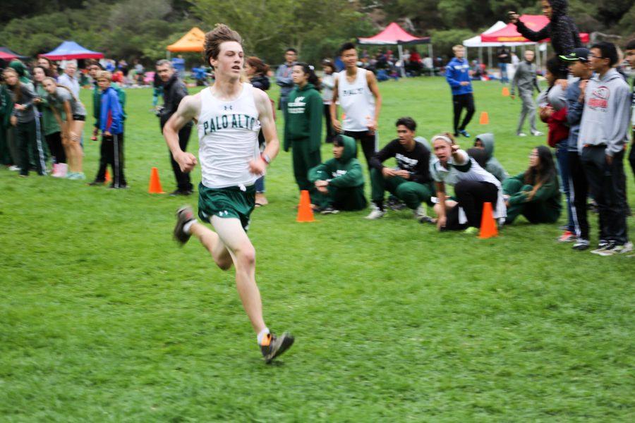 Junior Kent Slaney crosses the finish line in a cross country meet on September 12. The boys team placed first overall while the girls team placed fifth out of 18 teams.