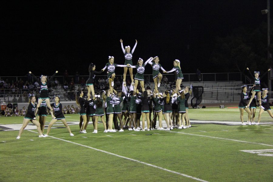 The Paly spirit squad, comprised of both cheer and dance, performs during halftime at the Paly football game against San Benito. 