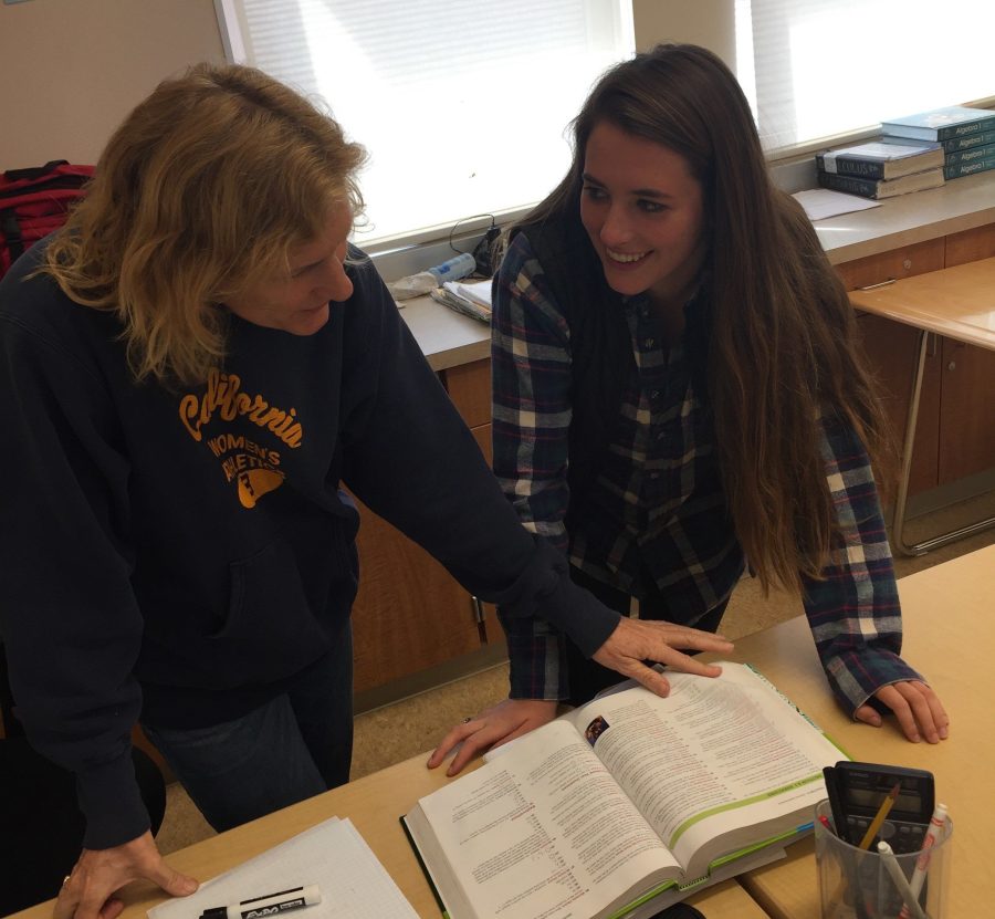 Natalie Docktor helps her daughter, senior Mikaela Simison, with her homework.
