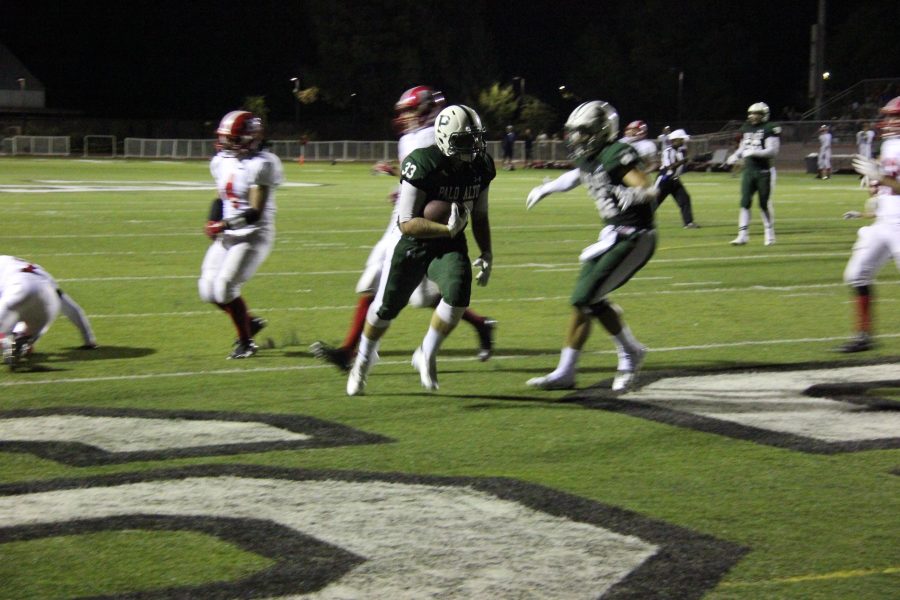 Senior fullback Shaun Pike rushes past defenders for a touchdown against Sequoia. 