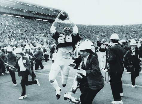 FILE--Cal's Kevin Moen (26) leaps with the ball in the air after scoring Cal's game-winning touchdown while the Stanford band runs to get out of his way in Berkeley, Calif., in this Nov. 25, 1982 file photo. Of the 101 previous games in the Stanford-Cal rivalry, 48 have been decided by a touchdown or less. Stanford, despite having the second-worst defense in the nation, needs a win over Cal on Saturday to go to the Rose Bowl for the first time since the 1971 season. (AP Photo/Oakland Tribune/Robert Stinnett)