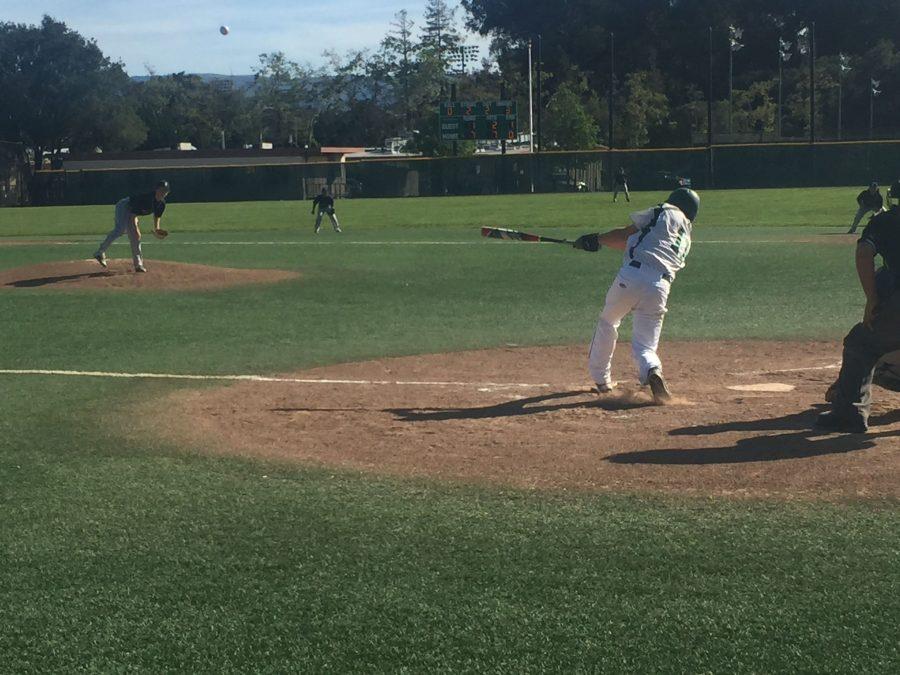 Junior Angus Stayte hits in a game against Saratoga High School on Wednesday, April 20. Paly beat Saratoga with a score of 10-1. 