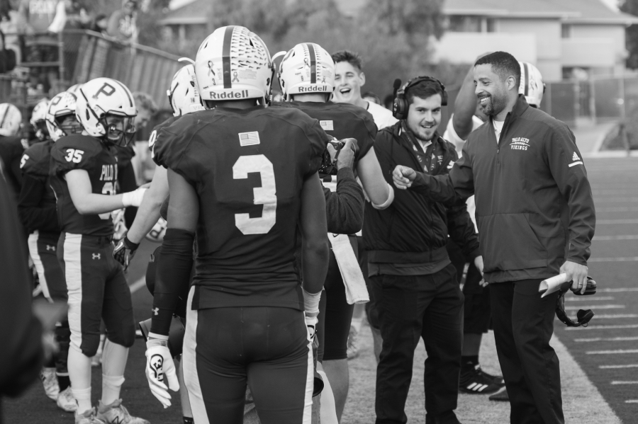 Score%21+Football+coach+Nelson+Gifford+wears+a+huge+smile+as+he+offers+a+celebratory+fist+bump+to+a+player+following+a+win+over+Los+Gatos+in+a+CCS+Playoff+game+last+season.+The+team+made+it+all+the+way+through+to+the+semifinals.+Gifford+replaces+previous+AD+Therren+Wilburn.