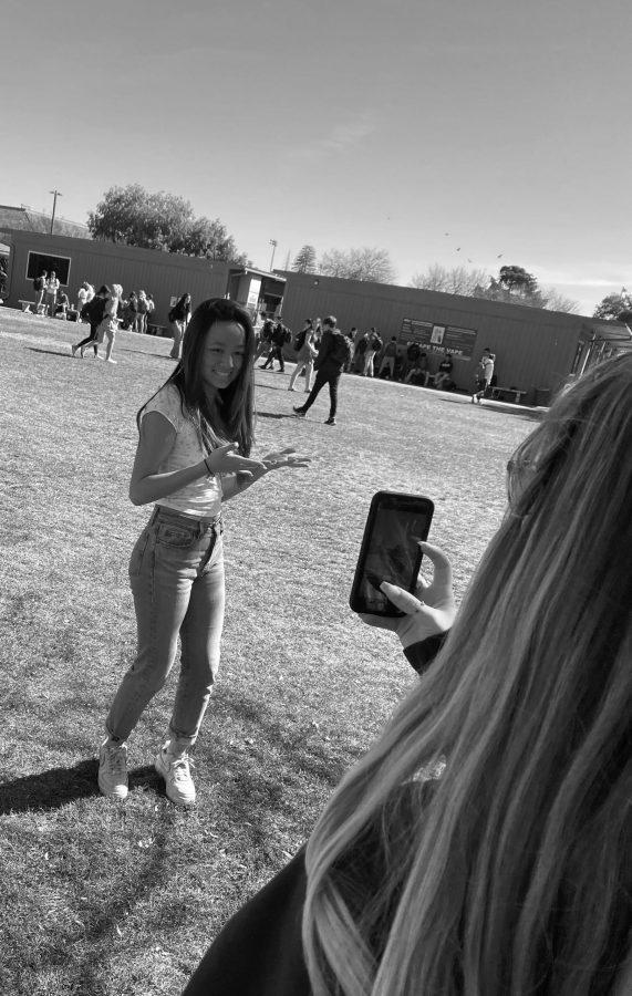 Renegade! Junior Keola Asing, whose most-viewed TikTok attracted 290,000 views, practices her renegade dance on the quad for her new TikTok account. Asing said, Live, love, laugh TikTok. By Bruno Klass