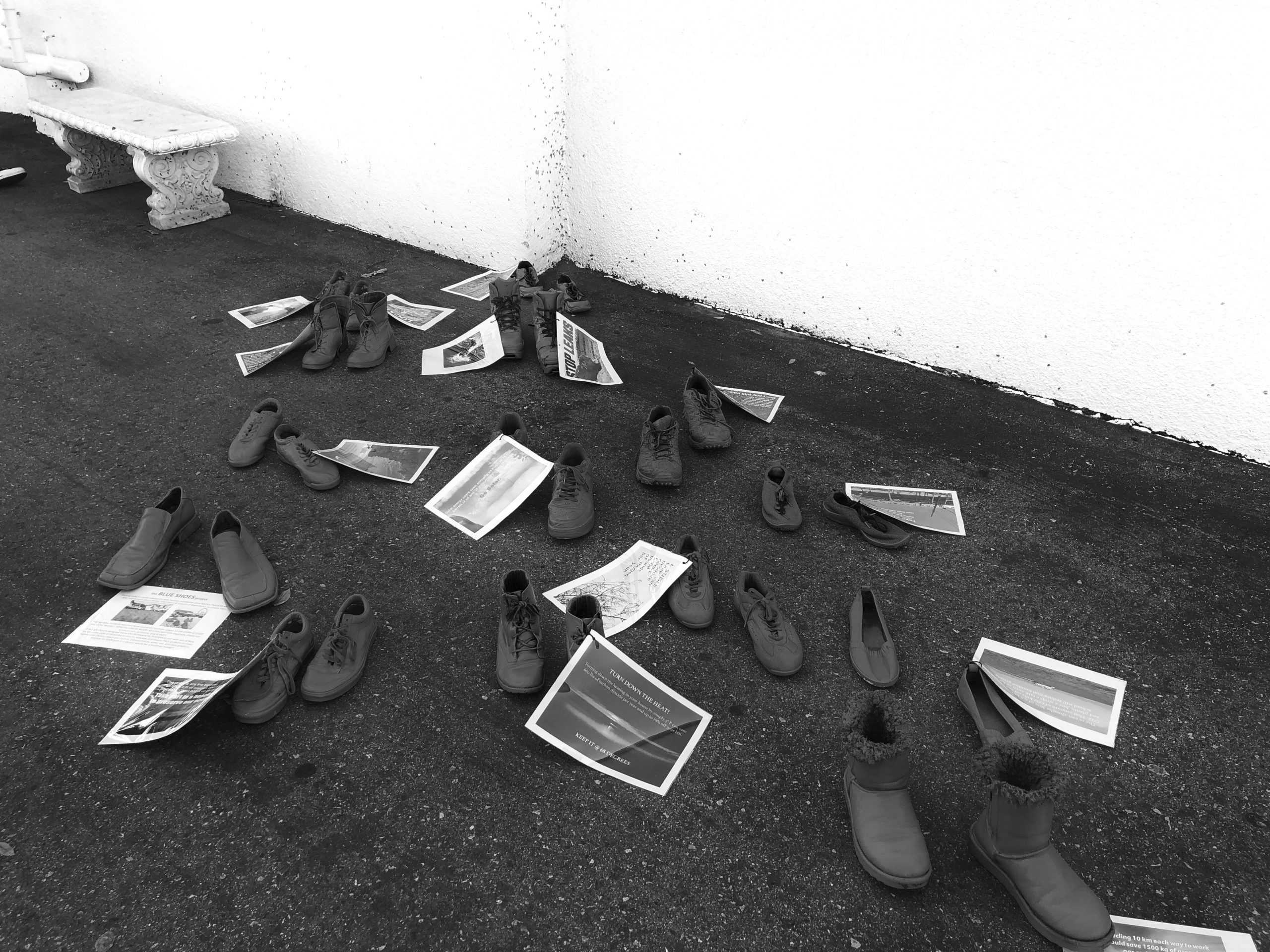 Photo students display blue shoes