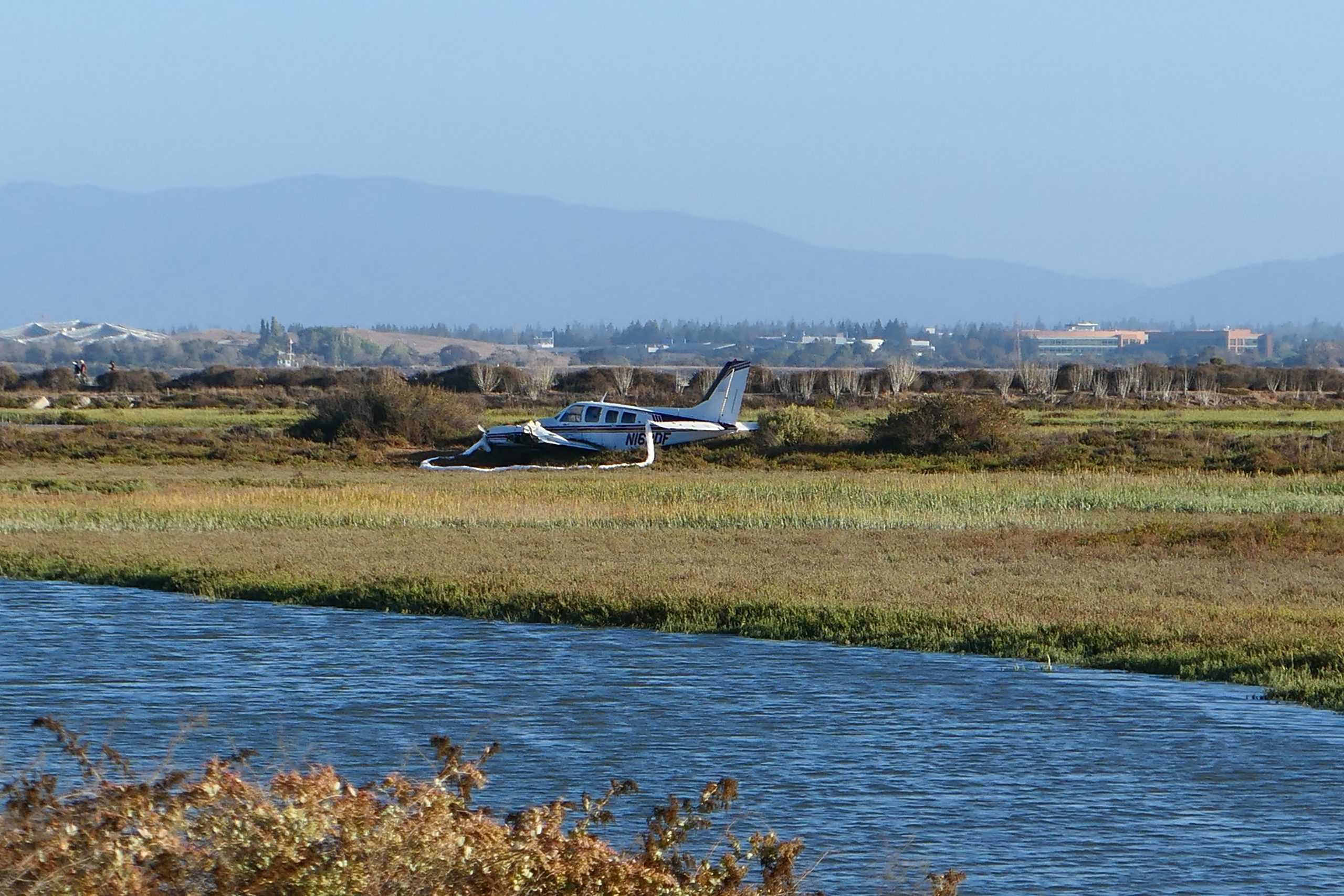 Twin-engine Beechcraft Baron 58P rests in the marshes of the Baylands after crashing there Monday afternoon. Photo by Cayden Gu