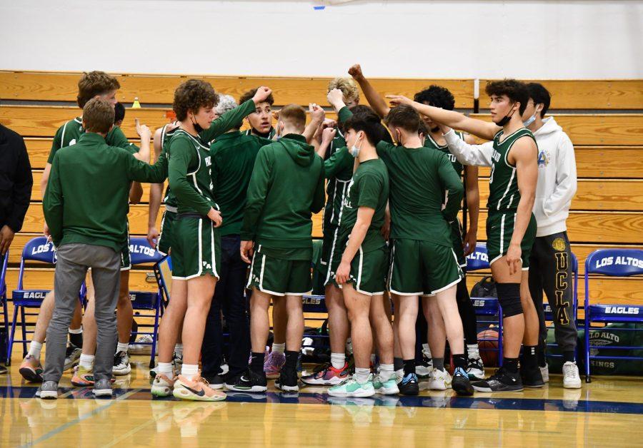 The boys varsity basketball team huddles before winning their final league game versus Los Altos 49-43 to win league. Photo by Charlotte Hallenbeck