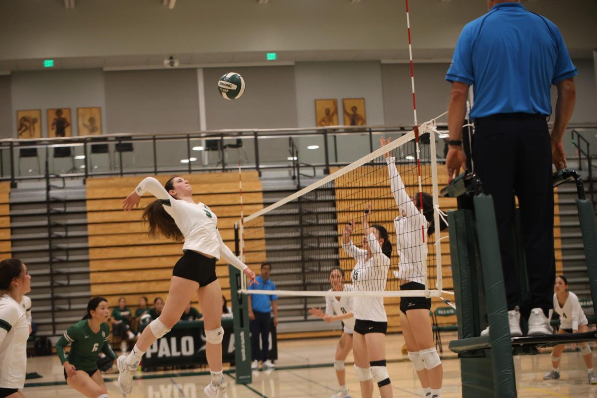 Senior and captain Naama Green jumps to spike the ball on Oct. 9 against Homestead High School. “It’s good that the team didn’t give up, and we just kept fighting,” said senior Mackenzie Zhao. “But (in) the end, we won.”