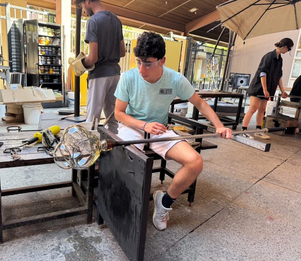 Senior and Fiery Arts Club Vice President Zachary Crystal turns a blown wire sculpture. “It’s awesome when you get to see the results of your own hard work,” Crystal said.