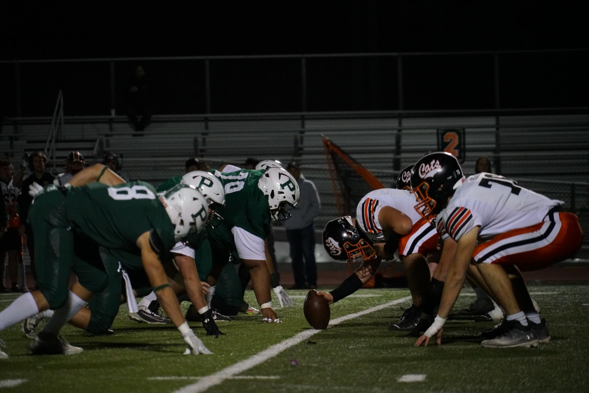 Varsity football gets ready for their first offensive play of the game. “We had a lot of young guys step up in the big moment,” senior and captain Joseph Kessler said. “They finally get a good taste of what it’s actually like, and I’m really proud of how they performed and handled the tough challenge.”