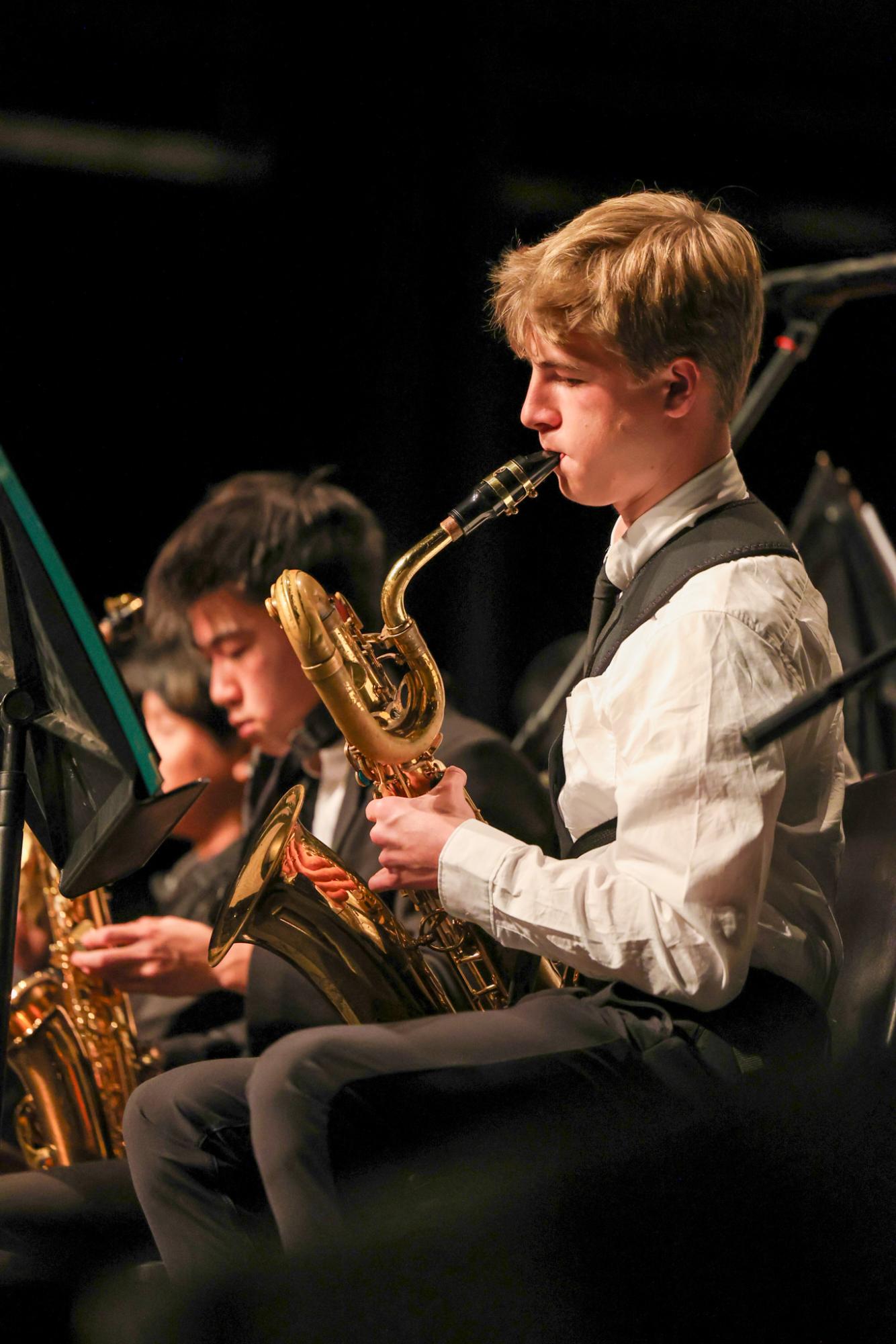 Freshman and Saxophonist Elliot Hull plays the jazz band’s  opening song. Gunn’s jazz band Director Shawn McGinn said the concert succeeded. “I’ve always loved the collaboration between Gunn and Paly,” McGinn said. “In athletics, there’s always a bit of a rivalry but in music, it’s ‘How can you work together best?’”