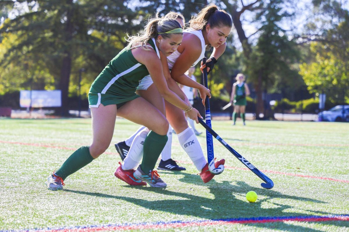 Senior and co-captain Sarah Thieman fights for the ball against Archbishop Mitty on Oct. 10. The team worked hard to gain the ball back from Mitty whenever they lost it, according to head coach Yuki Togawa. " We came up with the ball numerous times just by doing the hard work early and blocking those dangerous lanes," Togawa said. 
