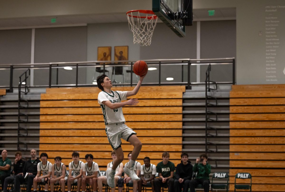 Sophomore Ian Cierniak goes for a layup after a turnover against Silver Creek. Cierniak said he was happy with the team’s performance in that game.  “We need to make sure we work consistently on applying pressure during those runs,” Cierniak said. “But overall, our defense, rotations and running the offense was pretty good.”
