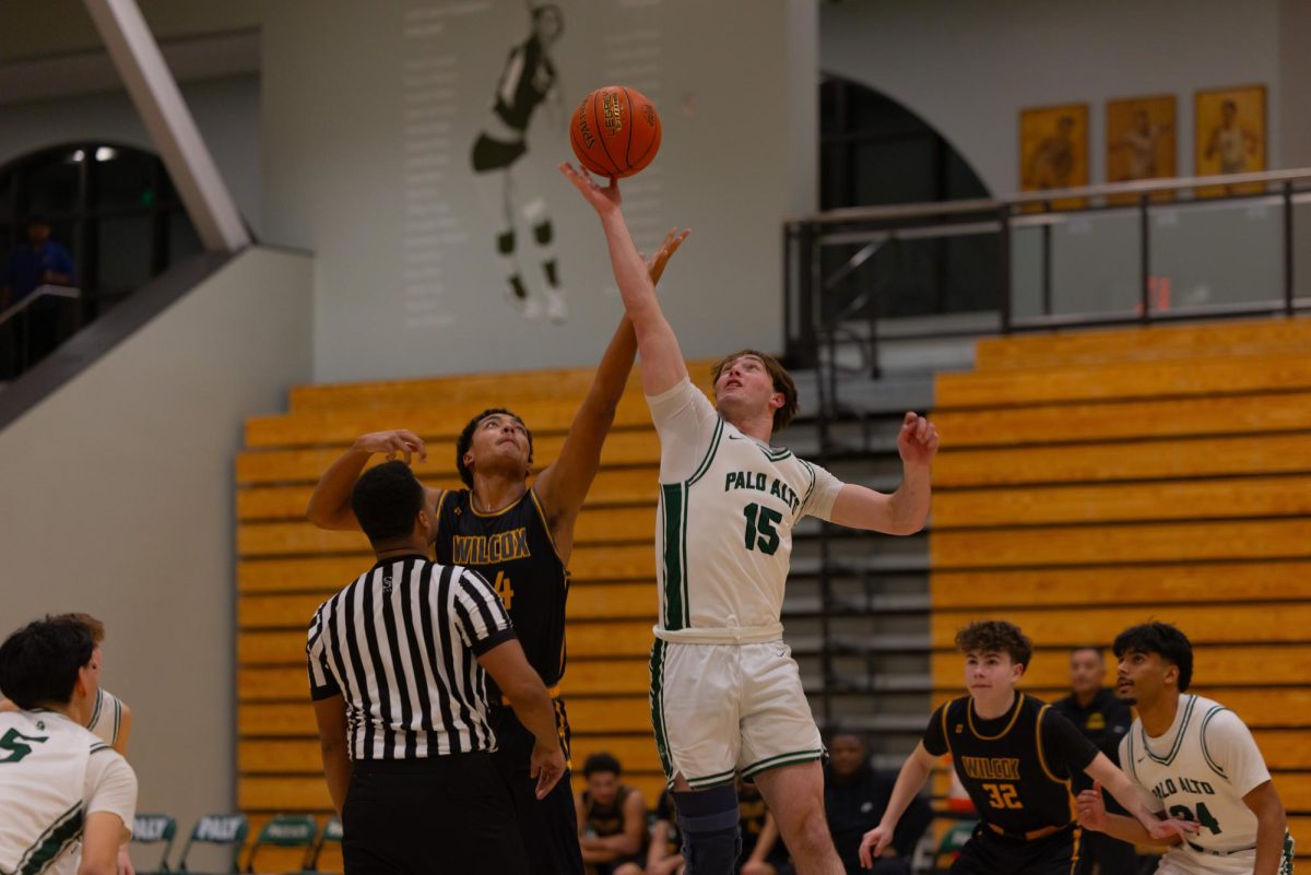Jumping up towards the ball, senior Jake Wang wins the tip off. “We had a full week of practice to really be able to work on our execution, work on our defense, and work on our offense, and that helped us out quite a bit,” Coach Jeff LaMere said.  “(The players) had quick hands, they rotated to the passing lanes, and we did a really good job of creating turnovers and then finishing plays.”
